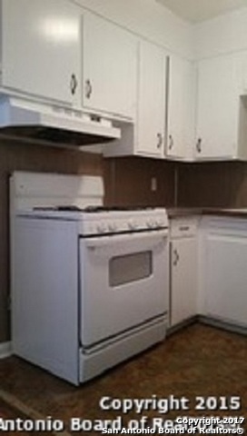 312 Babcock Road San Antonio, TX 78201 - Photo 4 of 10 a stove top oven sitting inside of a kitchen