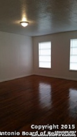 312 Babcock Road San Antonio, TX 78201 - Photo 8 of 10 a view of wooden floor and windows in a room