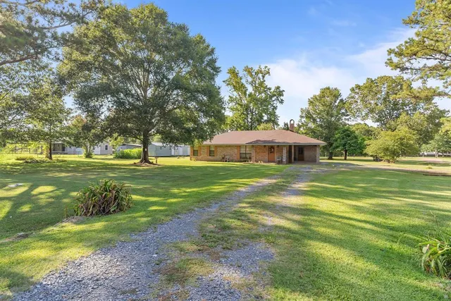 a view of a house with a big yard