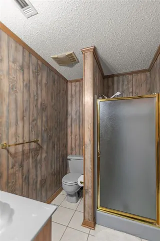 a bathroom with a shower and a sink