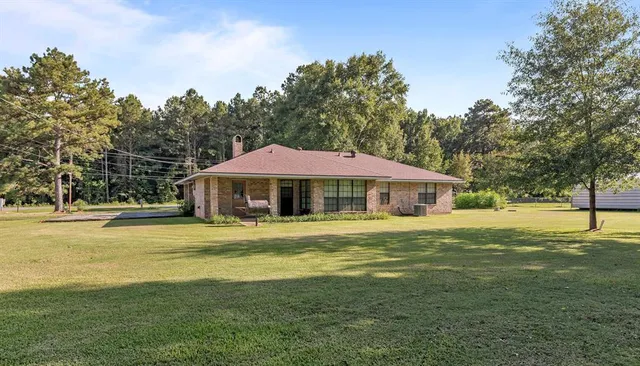 a view of a swimming pool with an outdoor space and seating area