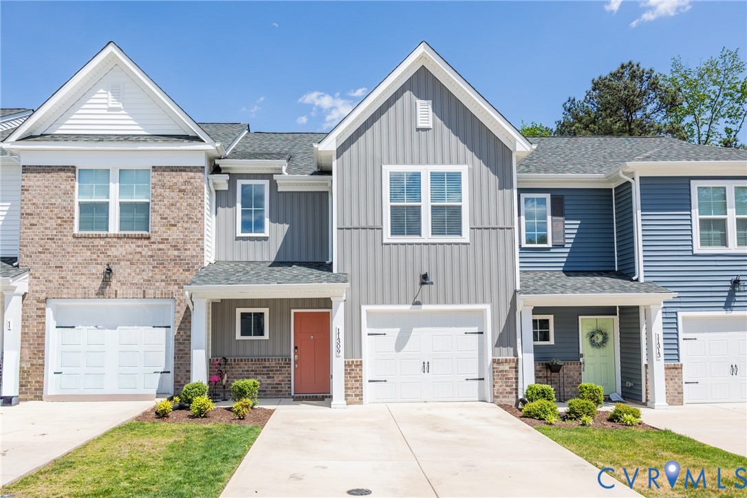 11309 Benton Pointe Way Chester, VA 23831 - Photo 1 of 32 a front view of a house with garden