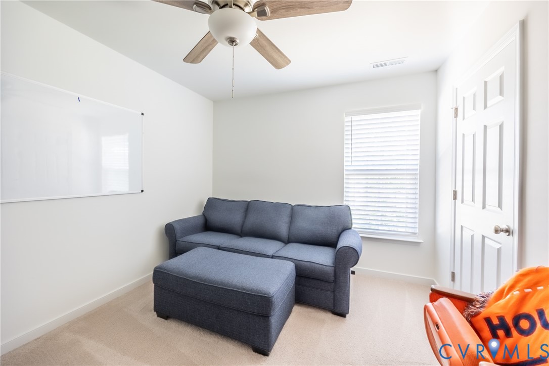 11309 Benton Pointe Way Chester, VA 23831 - Photo 23 of 32 a living room with furniture and a window