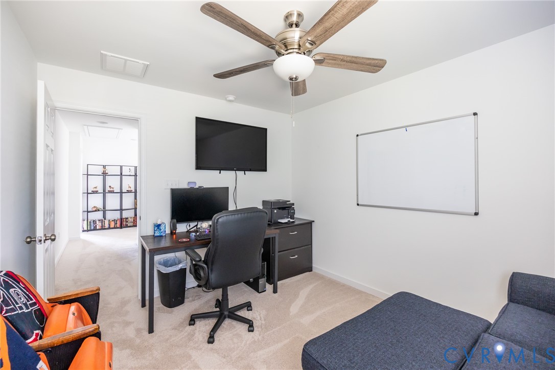 11309 Benton Pointe Way Chester, VA 23831 - Photo 24 of 32 a view of a workspace with furniture and a window