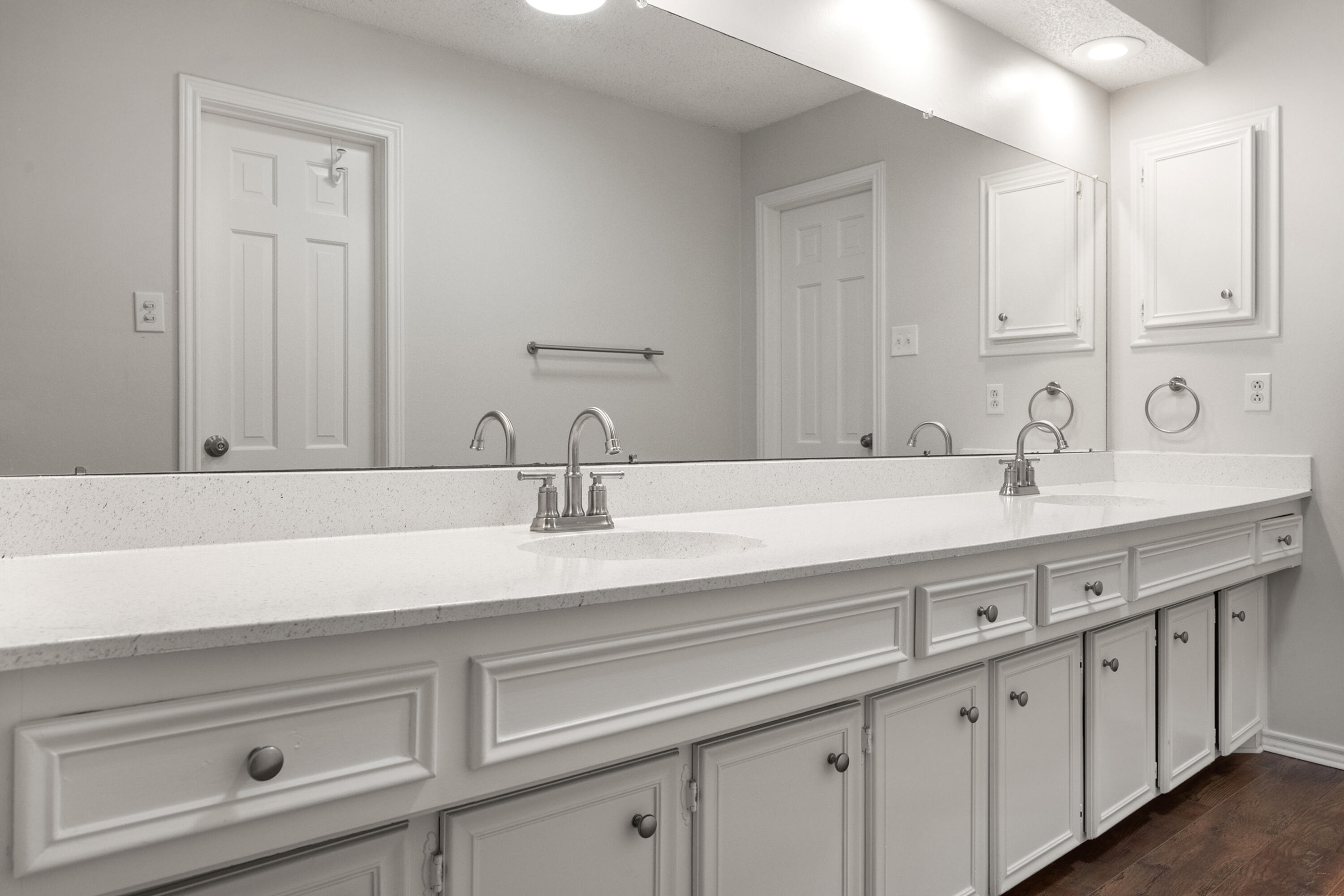 4523 79th Street Lubbock, TX 79424 - Photo 26 of 33 a bathroom with double sink and a mirror