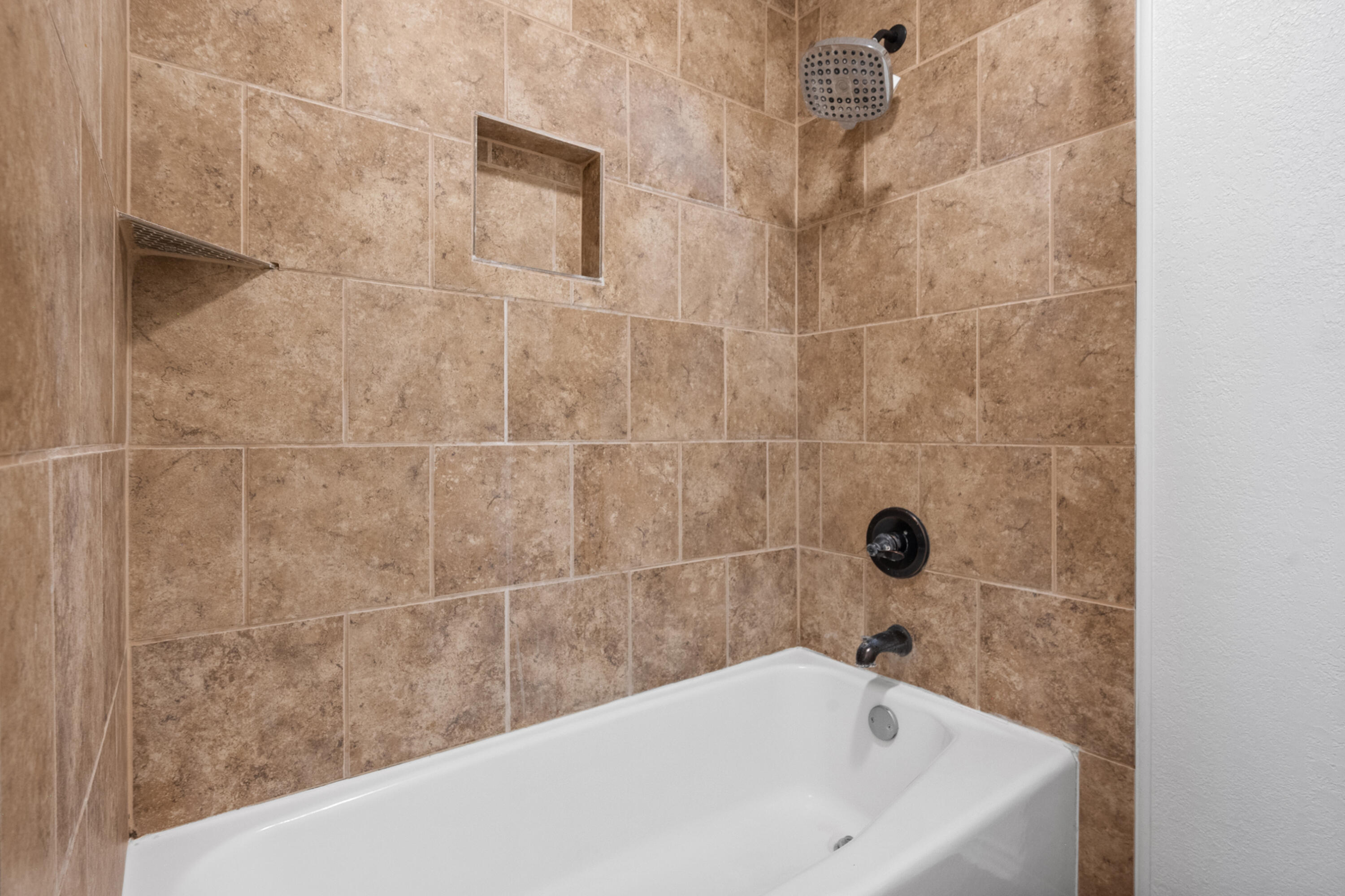 4523 79th Street Lubbock, TX 79424 - Photo 28 of 33 a bathroom with a bathtub