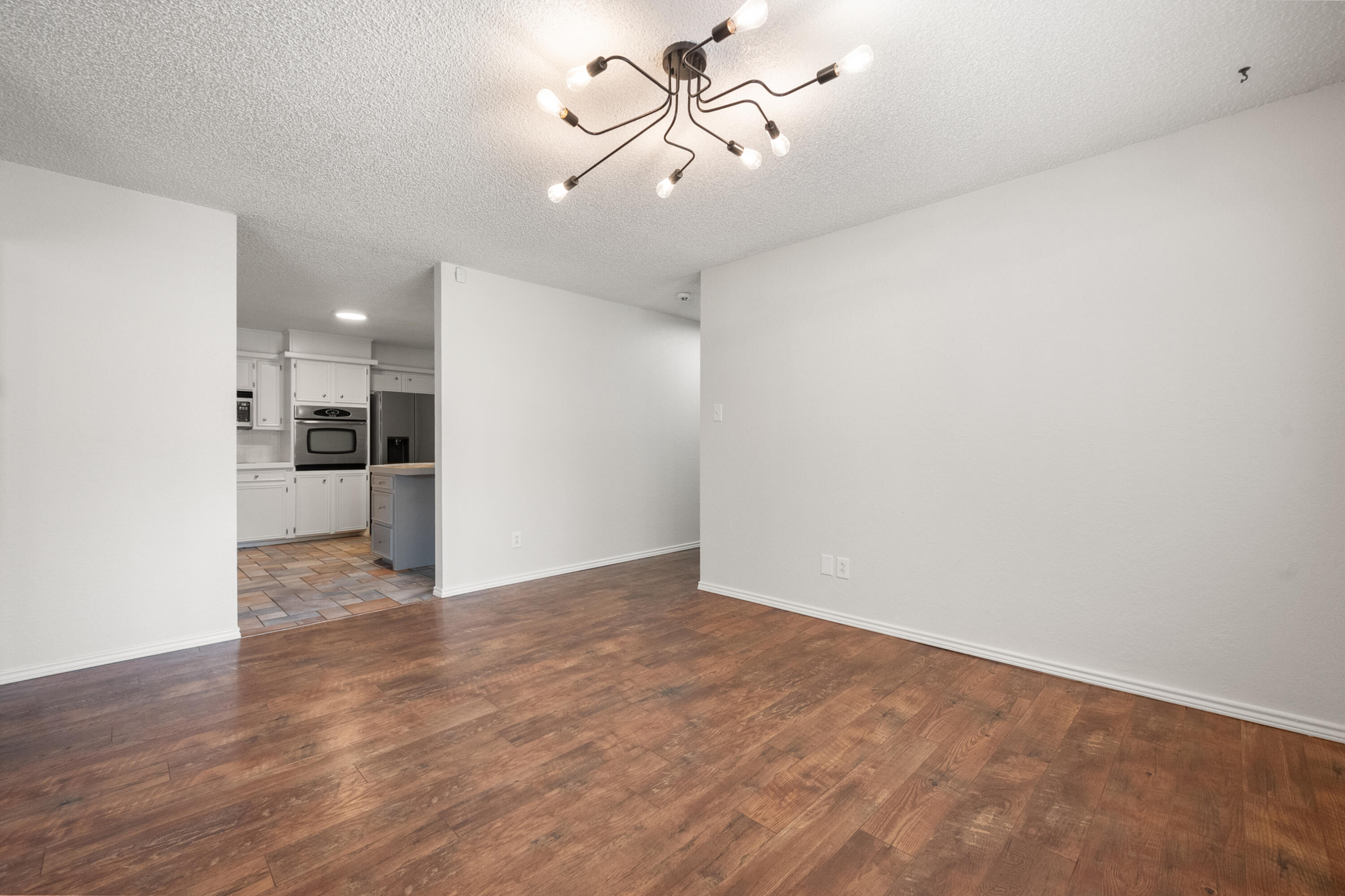 4523 79th Street Lubbock, TX 79424 - Photo 10 of 33 a view of a kitchen with a sink and refrigerator