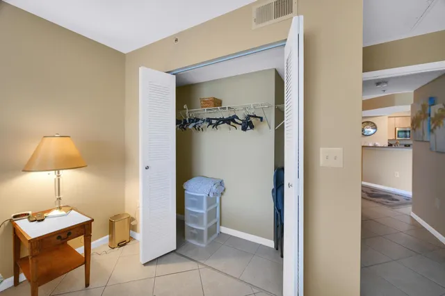 a view of a room with shelves and wooden floor