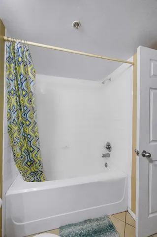 a bathroom with a bathtub and shower