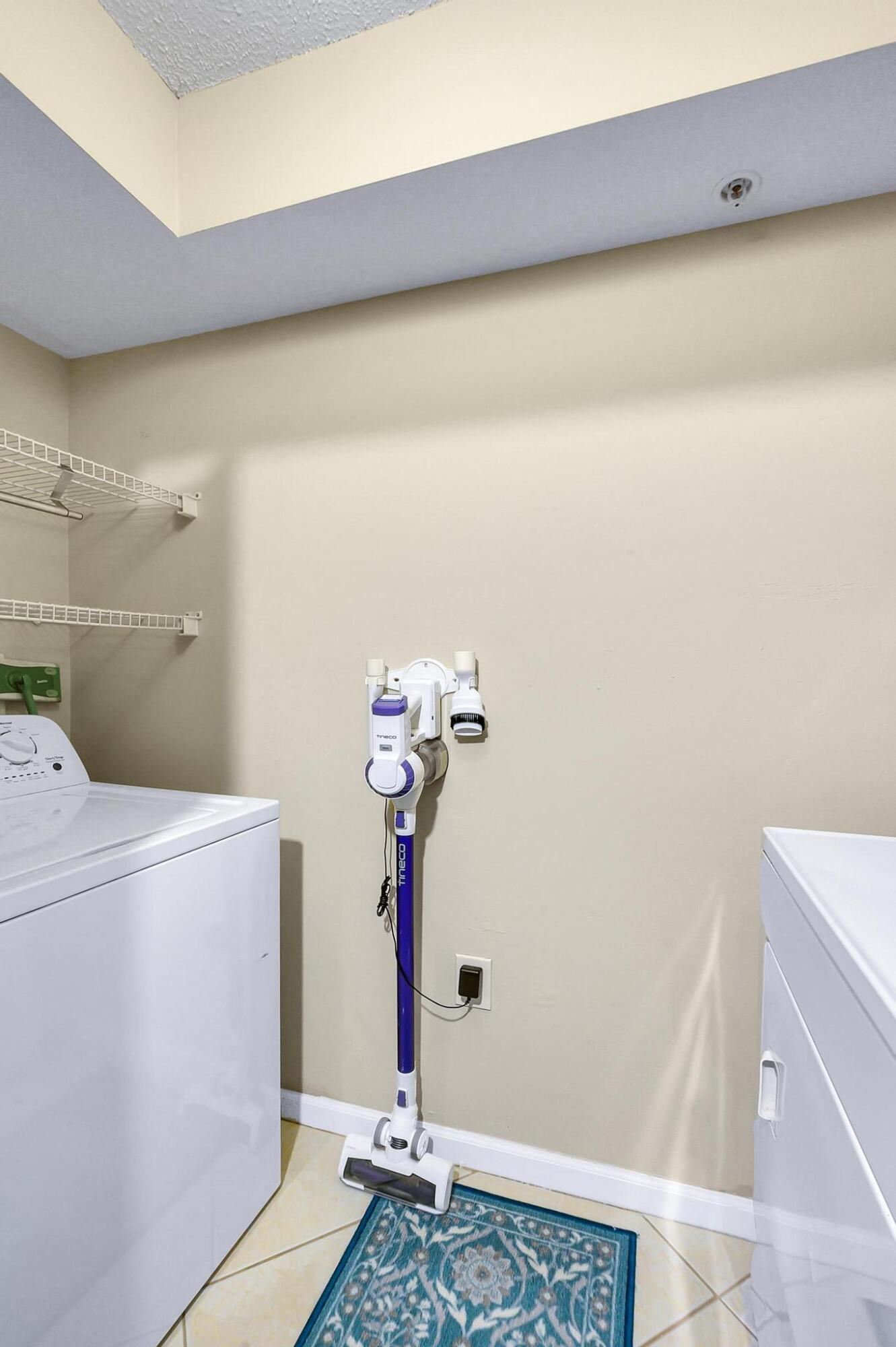 3670 Northwest Adriatic Lane Jensen Beach, FL 34957 - Photo 15 of 26 a bathroom with a sink and a shower curtain