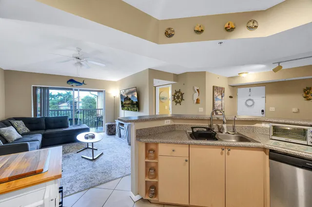 a living room with granite countertop furniture and a wooden floor