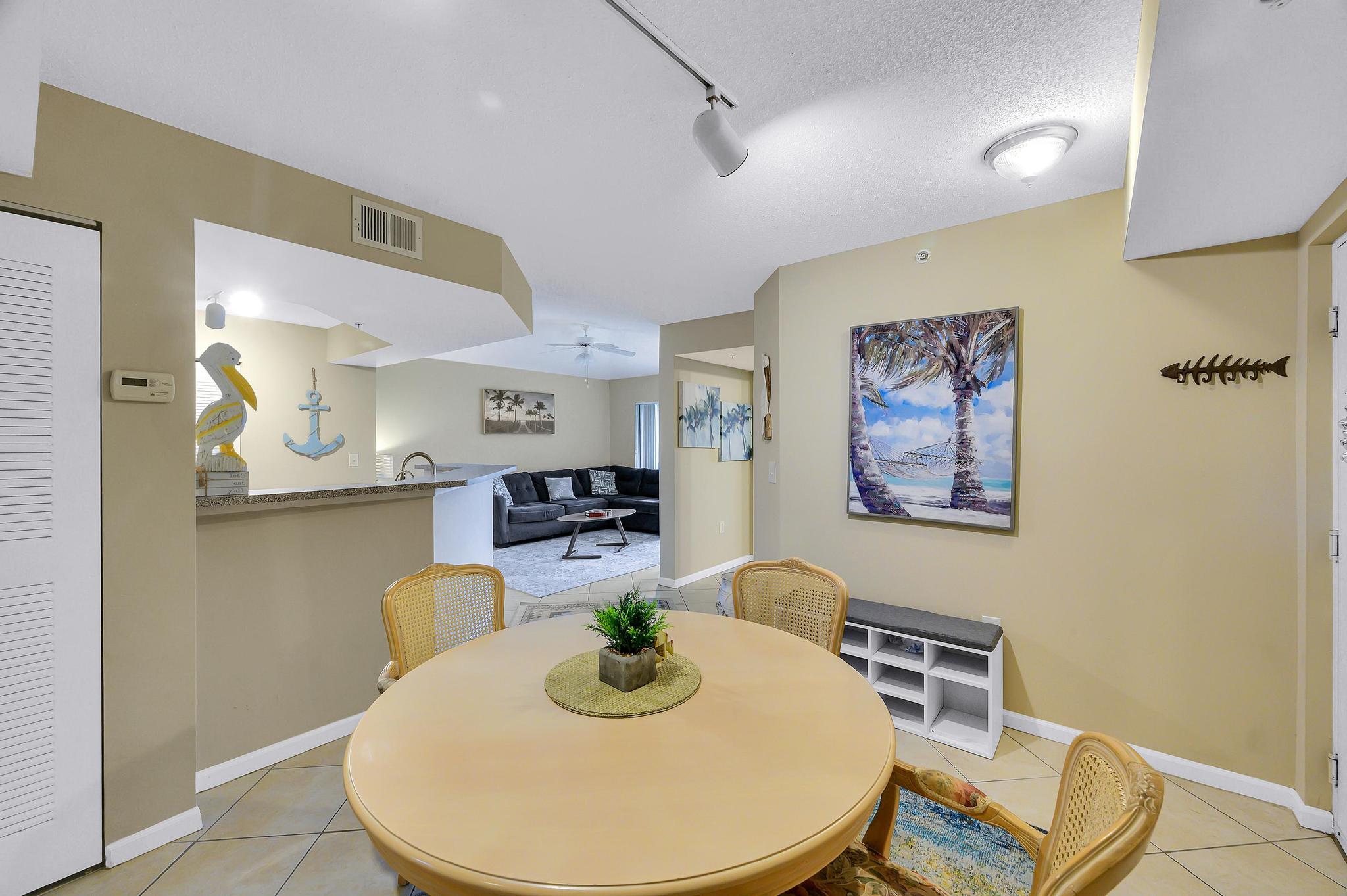 3670 Northwest Adriatic Lane Jensen Beach, FL 34957 - Photo 5 of 26 a dining room with furniture and wooden floor