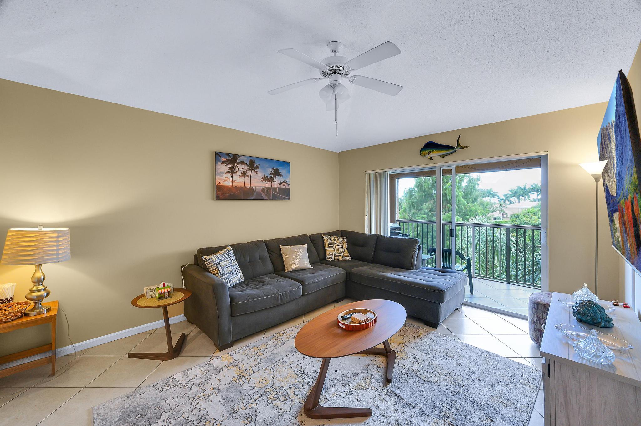 3670 Northwest Adriatic Lane Jensen Beach, FL 34957 - Photo 7 of 26 a living room with furniture and a large window
