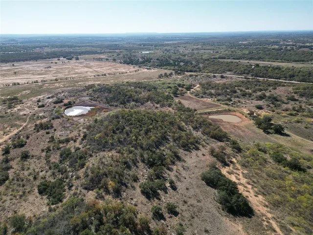 an aerial view of house with yard