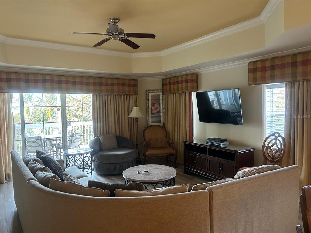 Undisclosed Address Reunion, FL 34747 - Photo 12 of 29 a living room with furniture and a flat screen tv