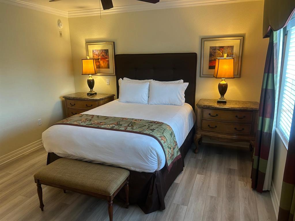 Undisclosed Address Reunion, FL 34747 - Photo 26 of 29 a bedroom with a bed and wooden floor