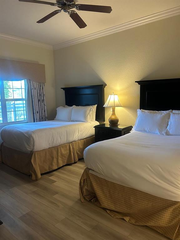 Undisclosed Address Reunion, FL 34747 - Photo 5 of 29 a bedroom with two beds and a ceiling fan