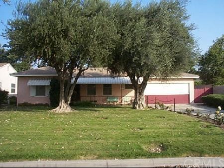 6974 Barcelona Way Riverside, CA 92504 - Photo 1 of 1 a view of a house with a yard