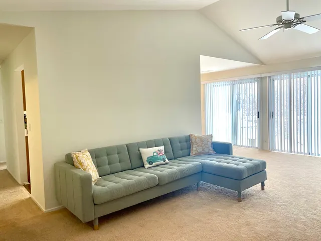 a living room with a couch and a window