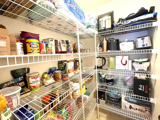 a front view of a building with outdoor seating