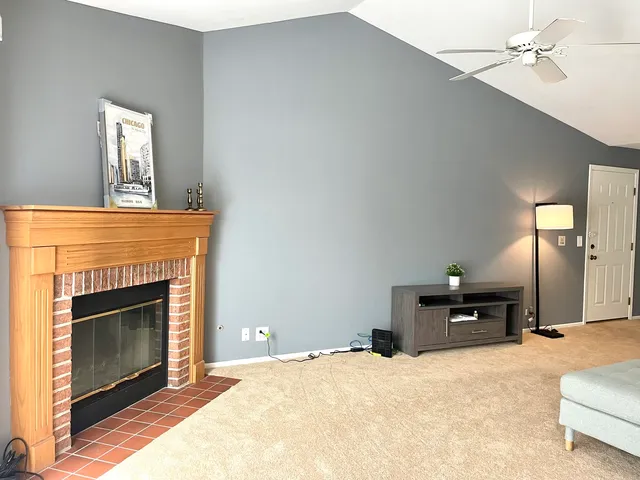 a bedroom with a bed and a fireplace