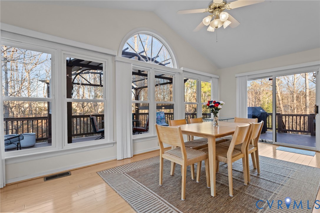 518 Rebel Ridge Road Colonial Heights, VA 23834 - Photo 7 of 44 a view of a dining room with furniture wooden floor and chandelier