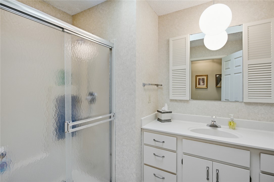6 Tradewinds Way Salem, SC 29676 - Photo 17 of 50 This bright bathroom features a glass-enclosed shower and a vanity with ample storage.