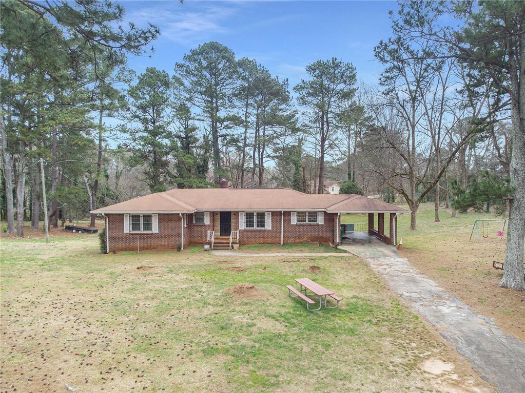 3496 Wesley Chapel Road Decatur, GA 30034 - Photo 1 of 1 front view of a house with a yard