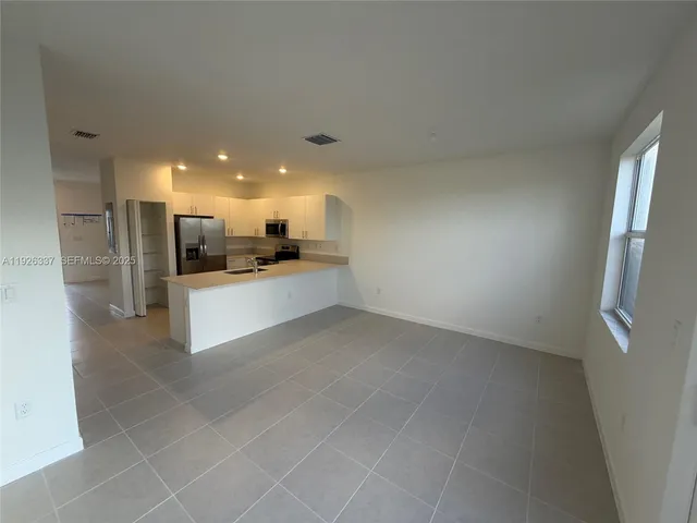 a view of a kitchen with a sink