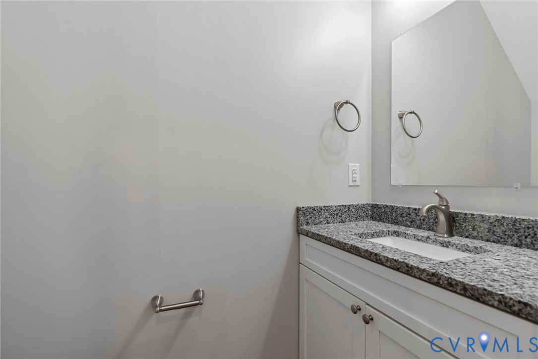 2768 Venter Road Aylett, VA 23009 - Photo 17 of 31 a bathroom with a granite countertop sink and mirror