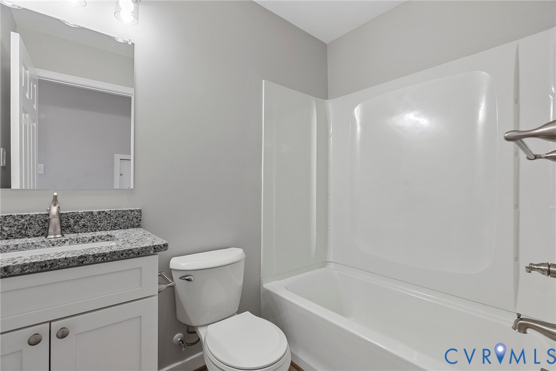 2768 Venter Road Aylett, VA 23009 - Photo 24 of 31 a white toilet sitting next to a bath tub