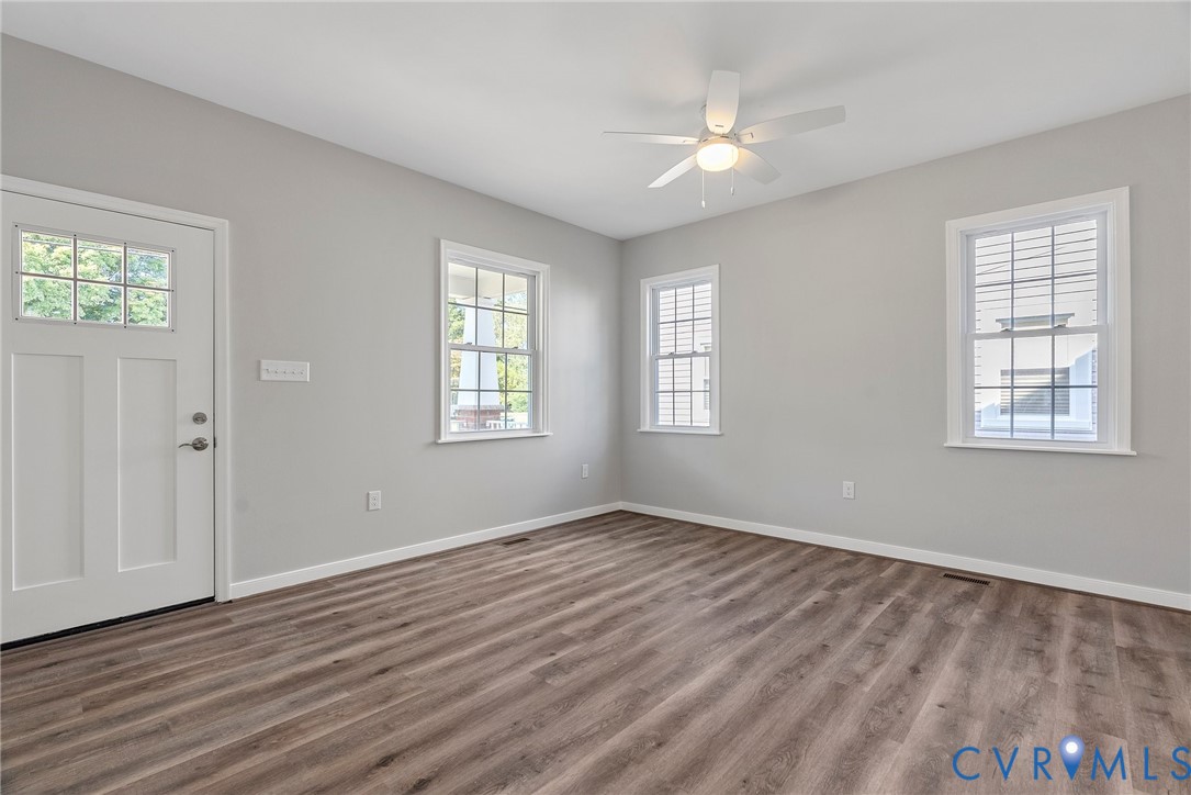 2768 Venter Road Aylett, VA 23009 - Photo 3 of 31 a view of an empty room with window and wooden floor