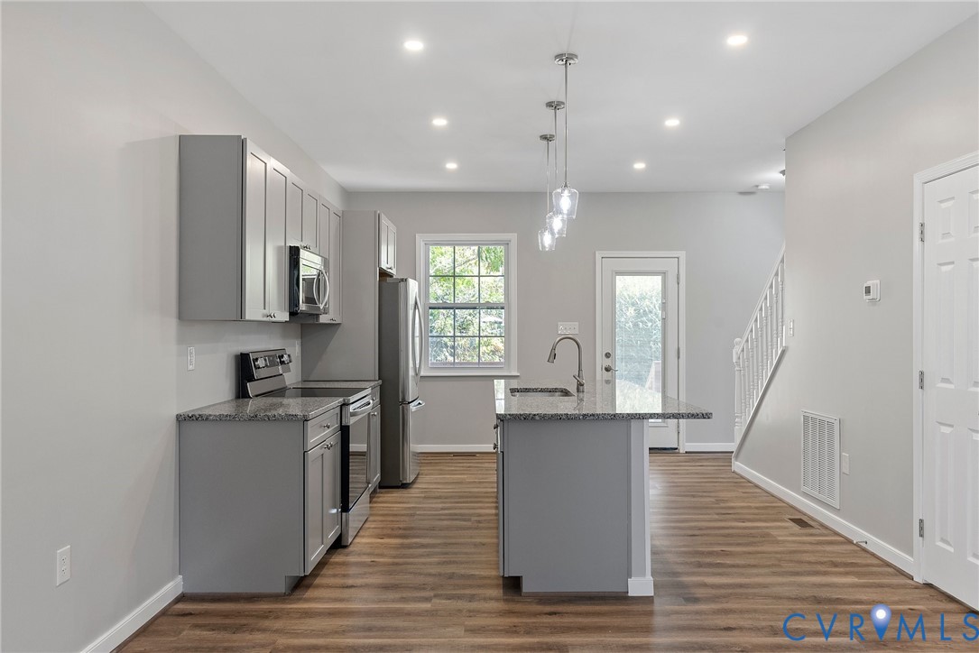 2768 Venter Road Aylett, VA 23009 - Photo 10 of 31 a kitchen with stainless steel appliances granite countertop wooden floors and sink