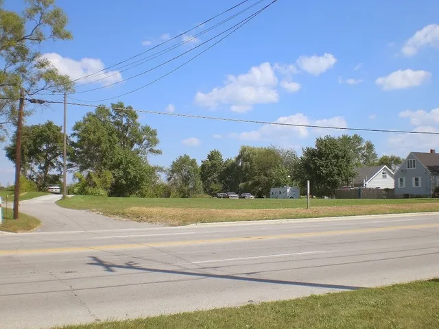 a view of a yard and ocean view