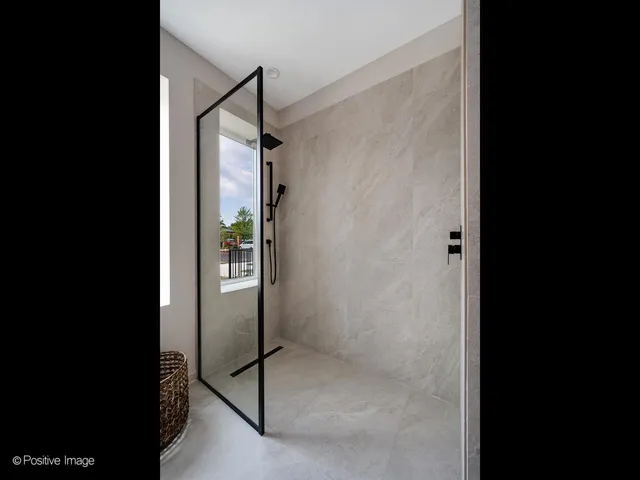 a bedroom with a bed and a mirror