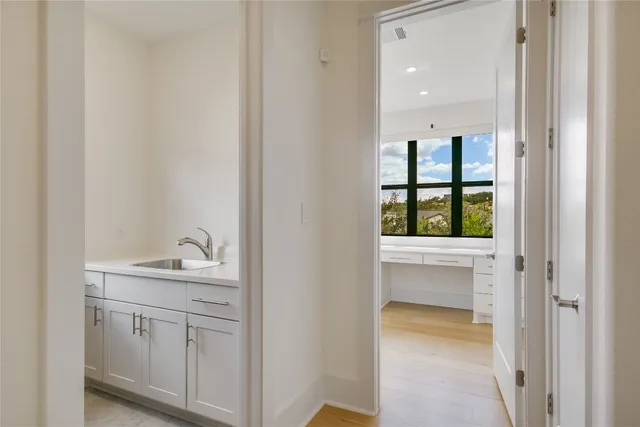 a bathroom with a sink and vanity
