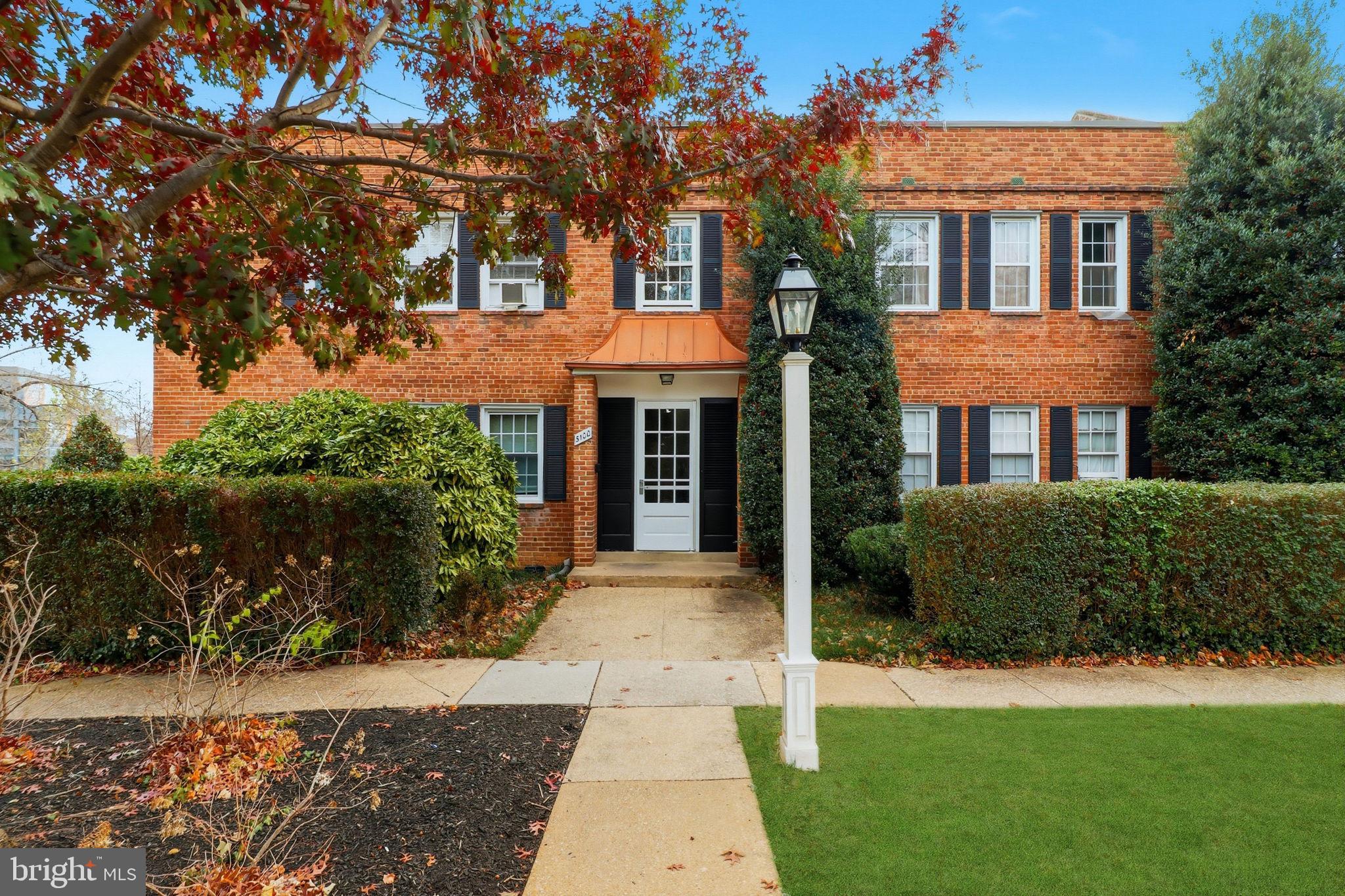 a front view of a house with yard