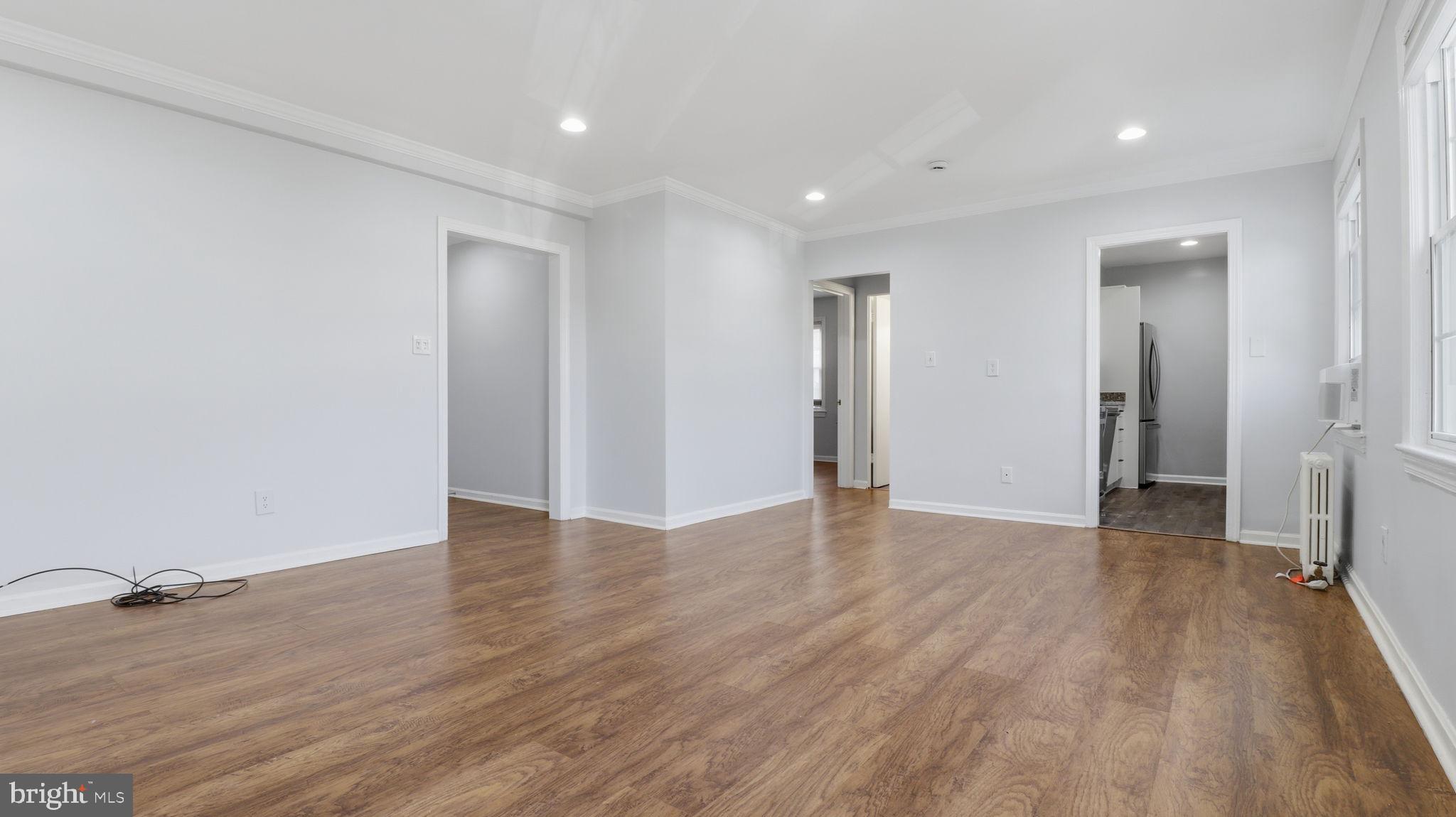 5100 Columbia Pike, Unit 1 Arlington, VA 22204 - Photo 15 of 40 a view of an empty room with wooden floor