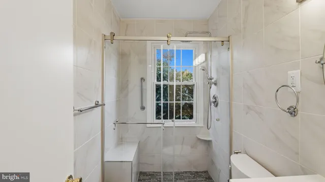 a bathroom with a glass shower door