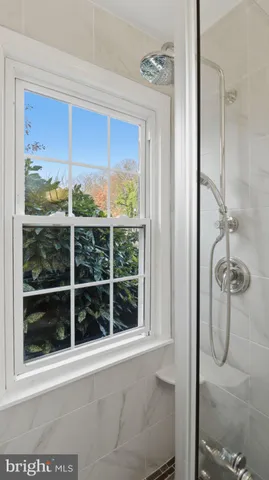 a view of a bathroom with a glass door