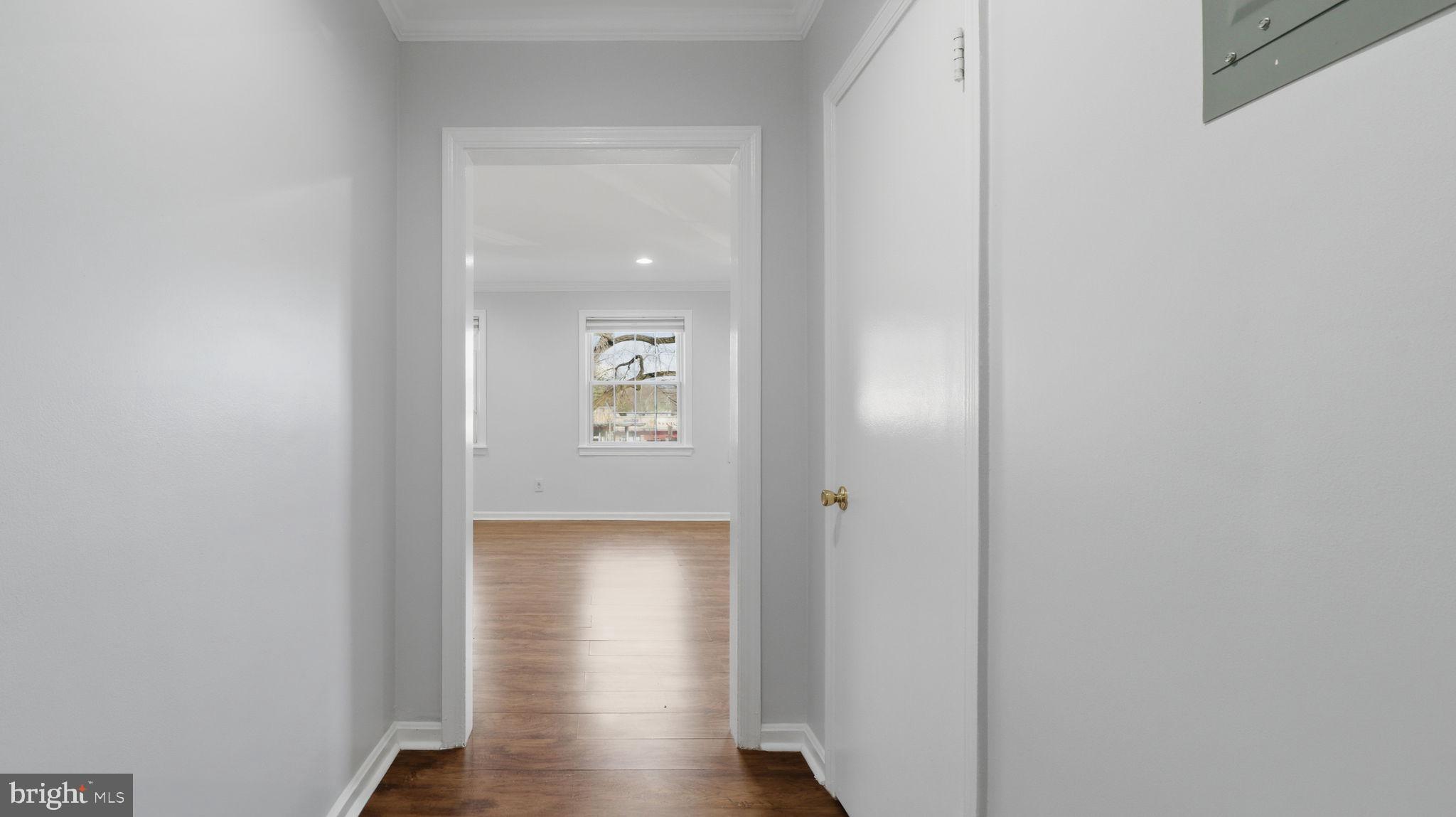 5100 Columbia Pike, Unit 1 Arlington, VA 22204 - Photo 22 of 40 a view of a hallway with wooden floor