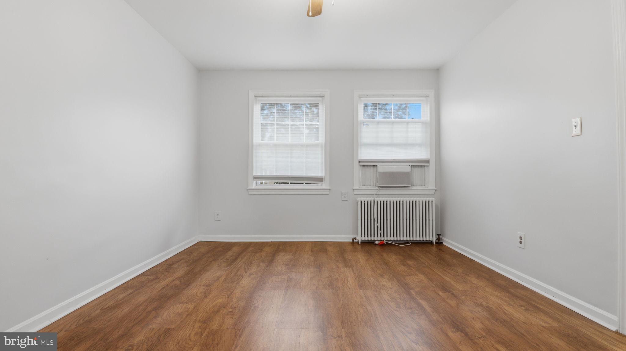 5100 Columbia Pike, Unit 1 Arlington, VA 22204 - Photo 28 of 40 an empty room with wooden floor and window