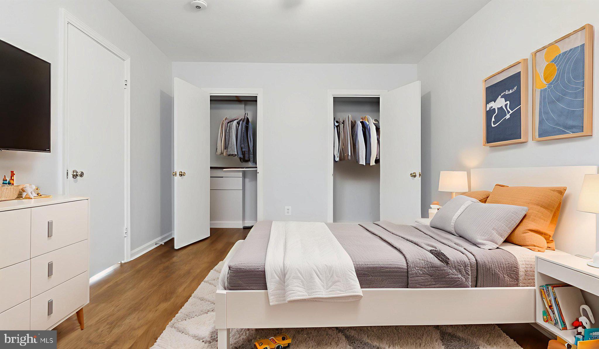 5100 Columbia Pike, Unit 1 Arlington, VA 22204 - Photo 29 of 40 a bedroom with a bed and a flat screen tv