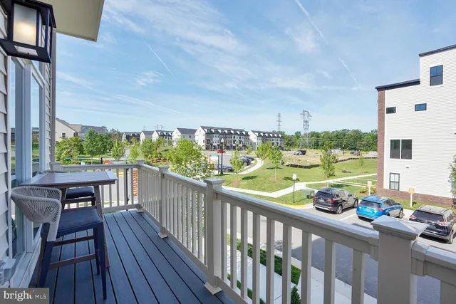 a view of a balcony with wooden floor
