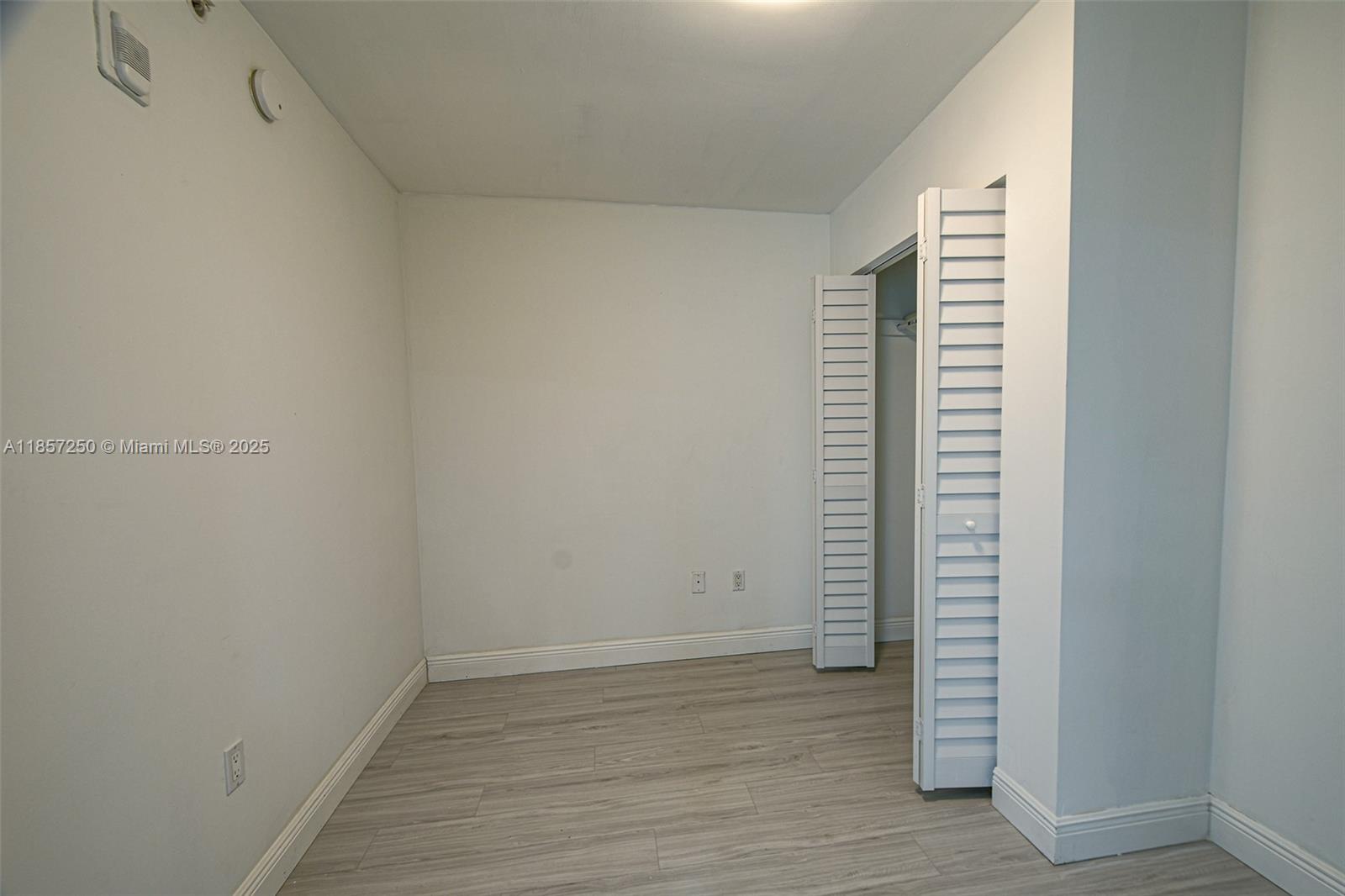 2740 Southwest 28th Terrace, Unit 603 Miami, FL 33133 - Photo 9 of 21 a view of an empty room with closet and a window