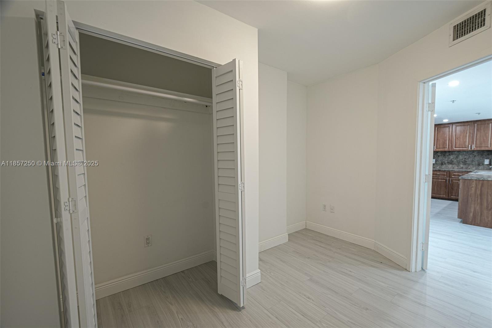 2740 Southwest 28th Terrace, Unit 603 Miami, FL 33133 - Photo 10 of 21 a view of empty room with wooden floor