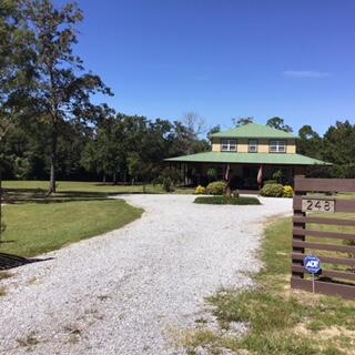 a view of a swimming pool with a yard