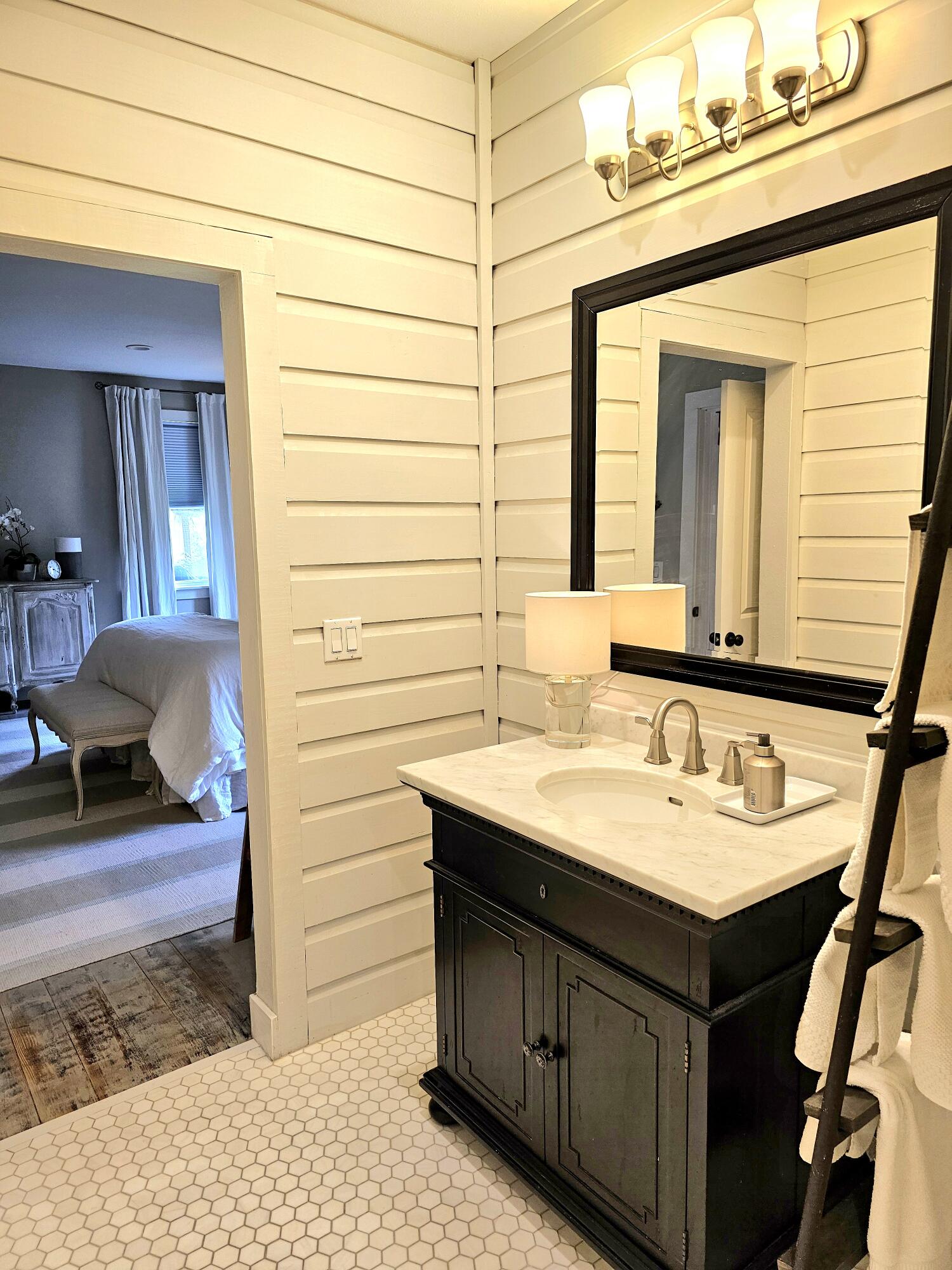 248 Blueberry Road Freeport, FL 32439 - Photo 16 of 37 a bathroom with a sink and a mirror