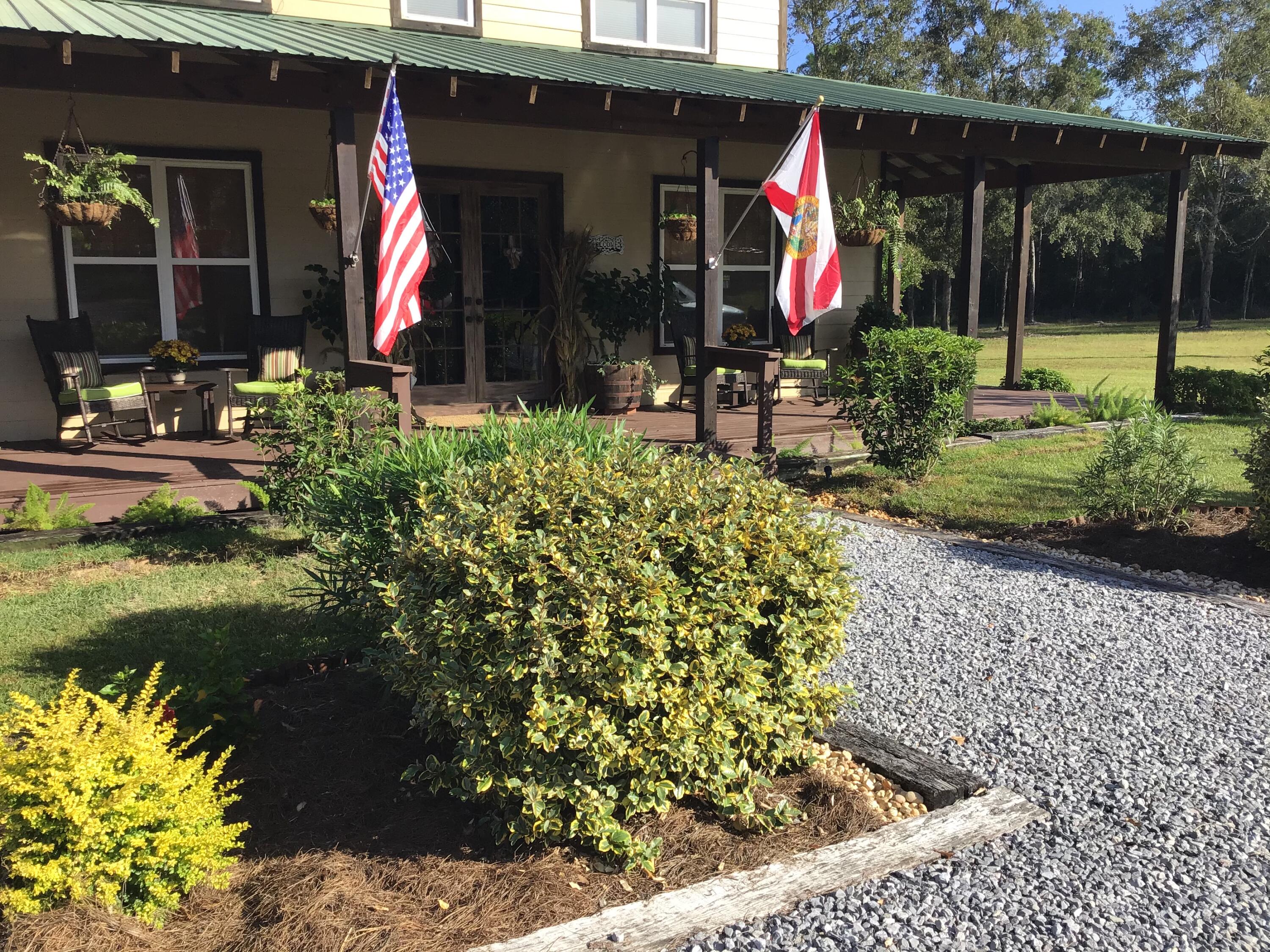 248 Blueberry Road Freeport, FL 32439 - Photo 2 of 37 a view of water fountain in front of house