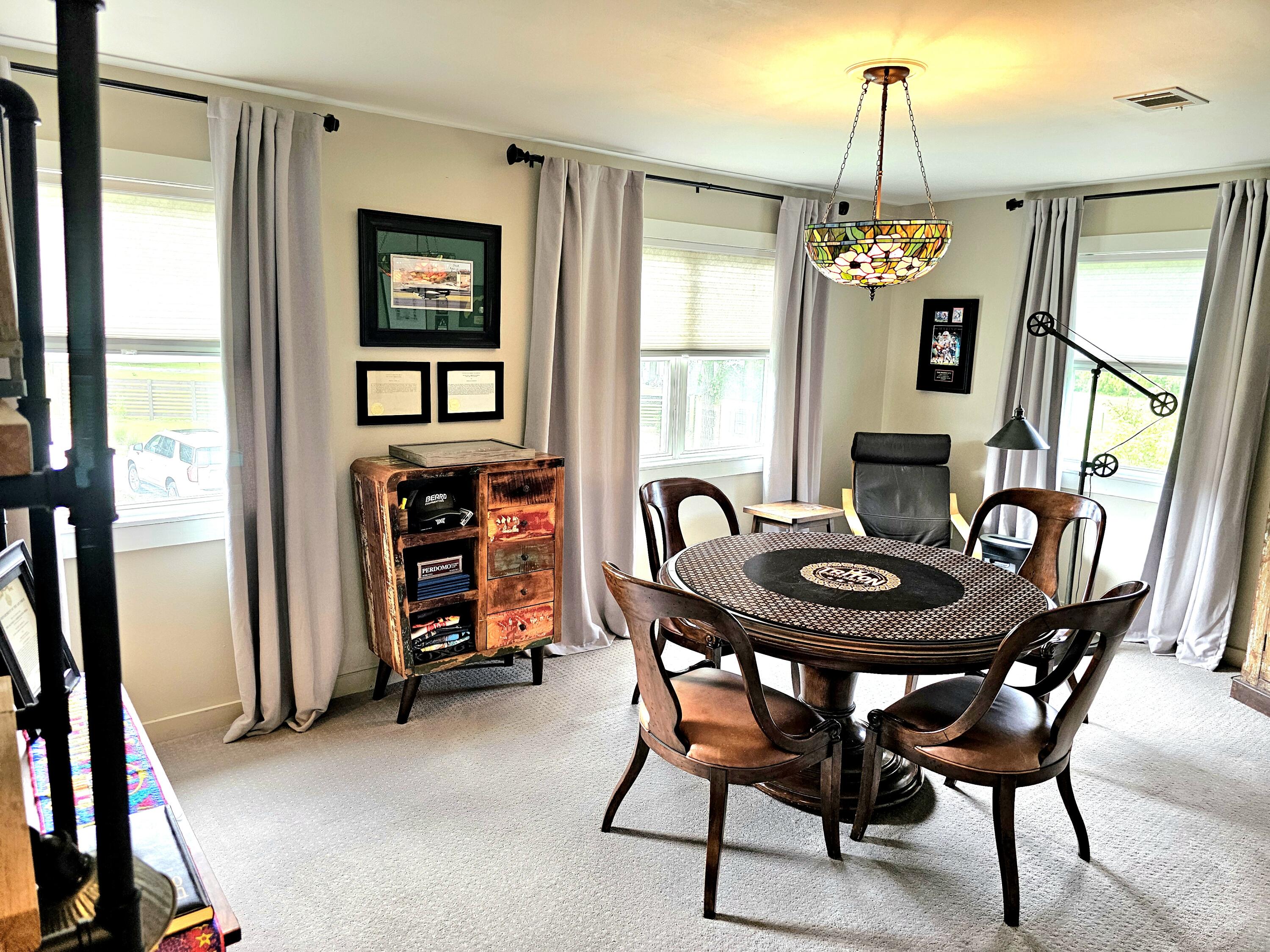 248 Blueberry Road Freeport, FL 32439 - Photo 22 of 37 a view of a dining room with furniture window and wooden floor
